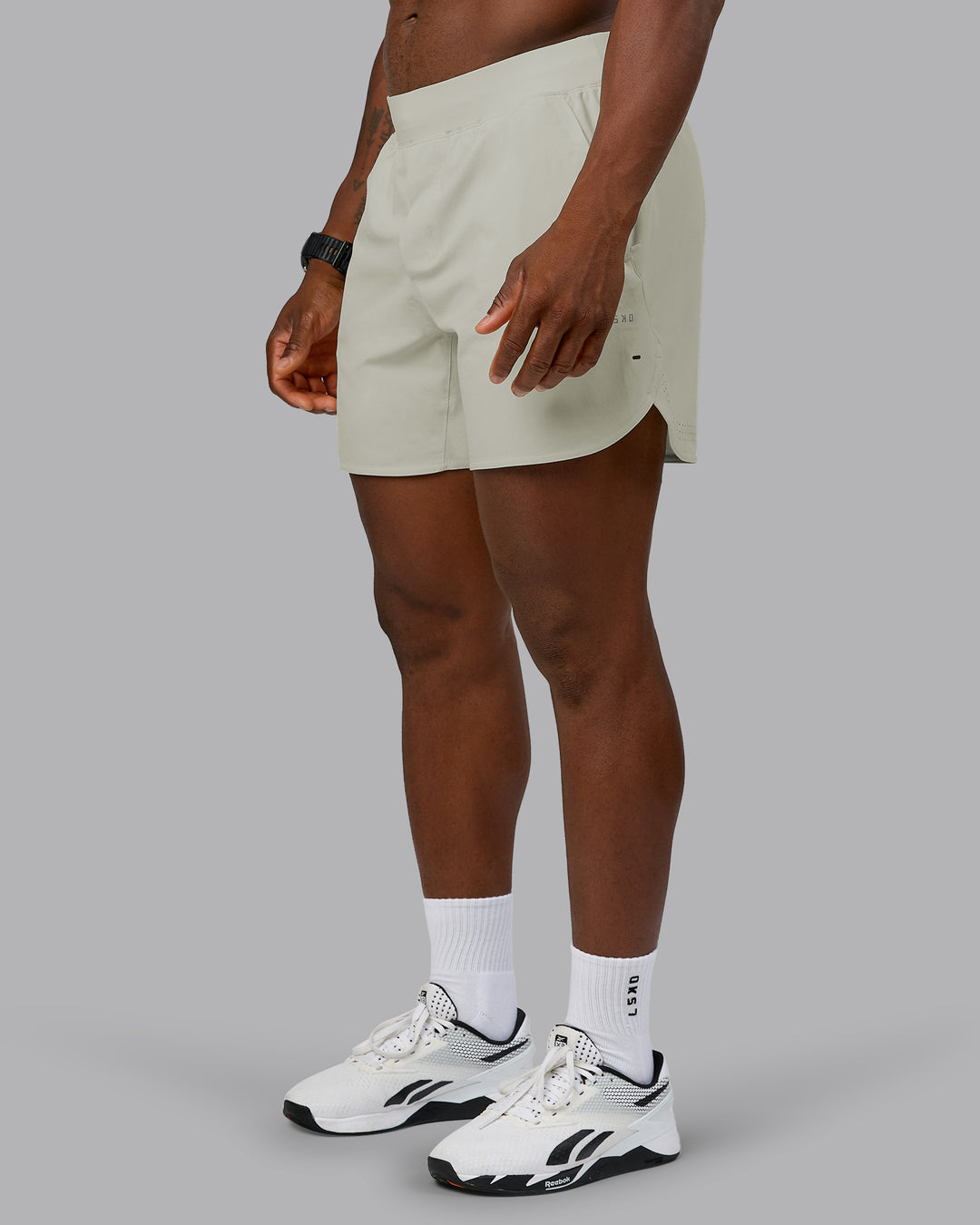 Man wearing Lift 6" Performance Short - Bone | Model:Sam | Size:L - view 7