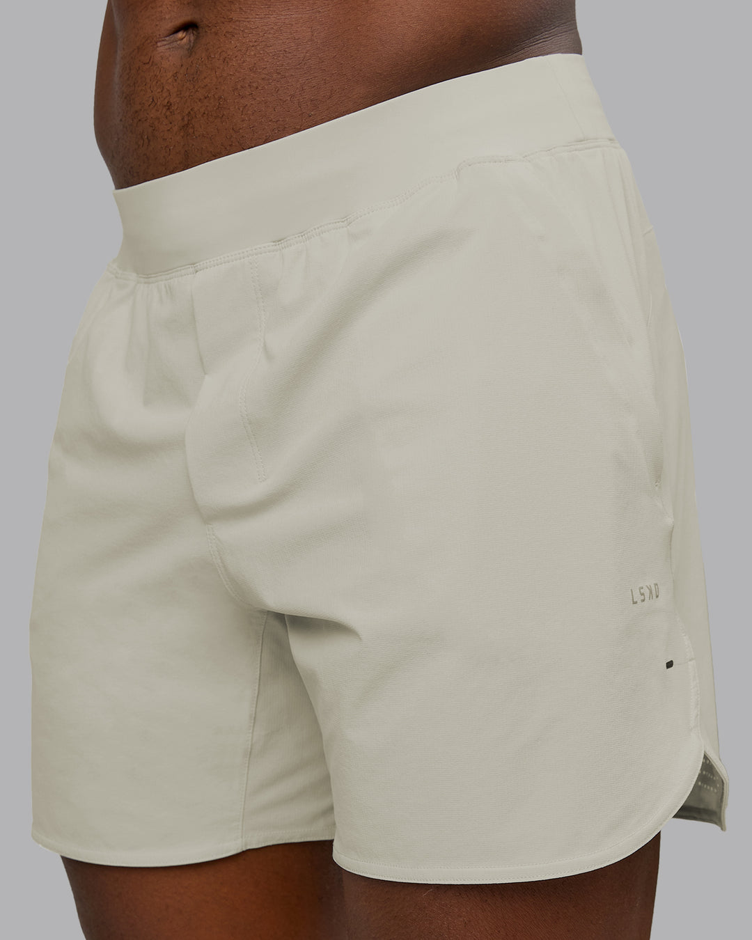 Man wearing Lift 6" Performance Short - Bone | Model:Sam | Size:L - view 1