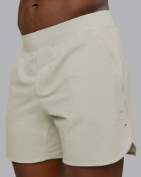 Man wearing Lift 6" Performance Short - Bone | Model:Sam | Size:L | Thumbnail Index: 0