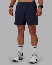 Man wearing Lift 6" Performance Shorts - Future Navy | Thumbnail Index: 5