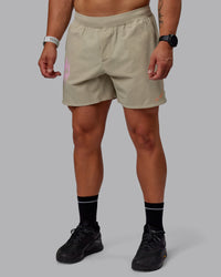 Man wearing Lift 6" Performance Shorts - Sand-So Cal 24 | Thumbnail Index: 0
