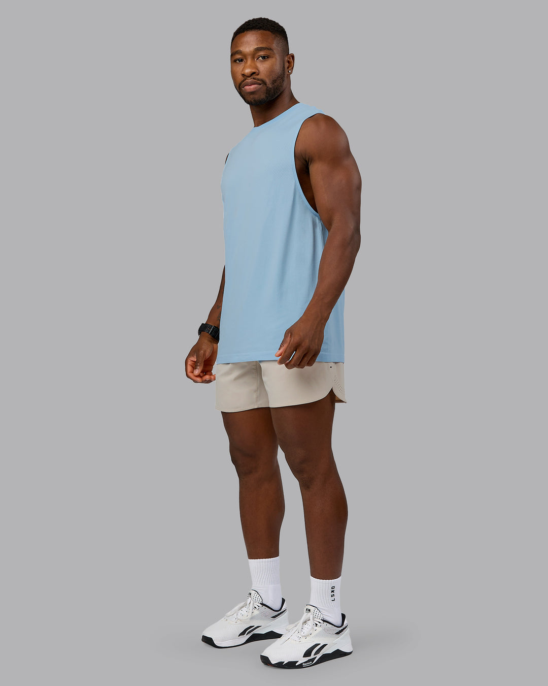 Man wearing Lift 6" Performance Short - Shale-Beige | Model:Sam | Size:L - view 5