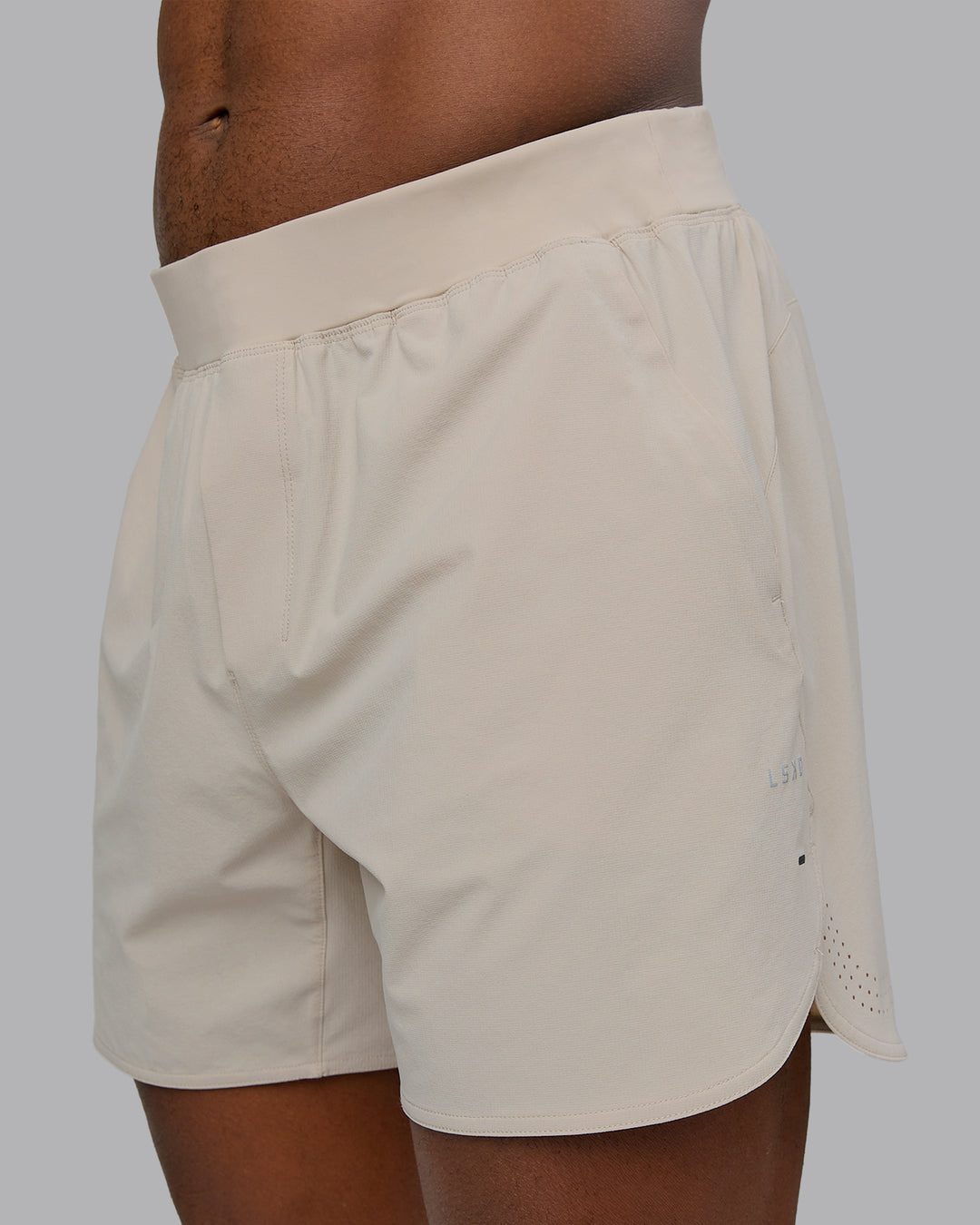 Man wearing Lift 6" Performance Short - Shale-Beige | Model:Sam | Size:L - view 2