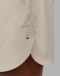 Man wearing Lift 6" Performance Short - Shale-Beige | Model:Sam | Size:L | Thumbnail Index: 5