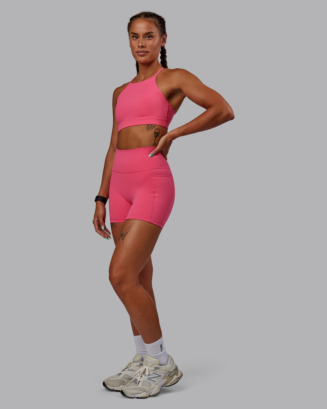 Woman wearing Lift High Neck Sports Bra - Hot Pink - view 1