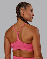Woman wearing Lift High Neck Sports Bra - Hot Pink | Thumbnail Index: 1