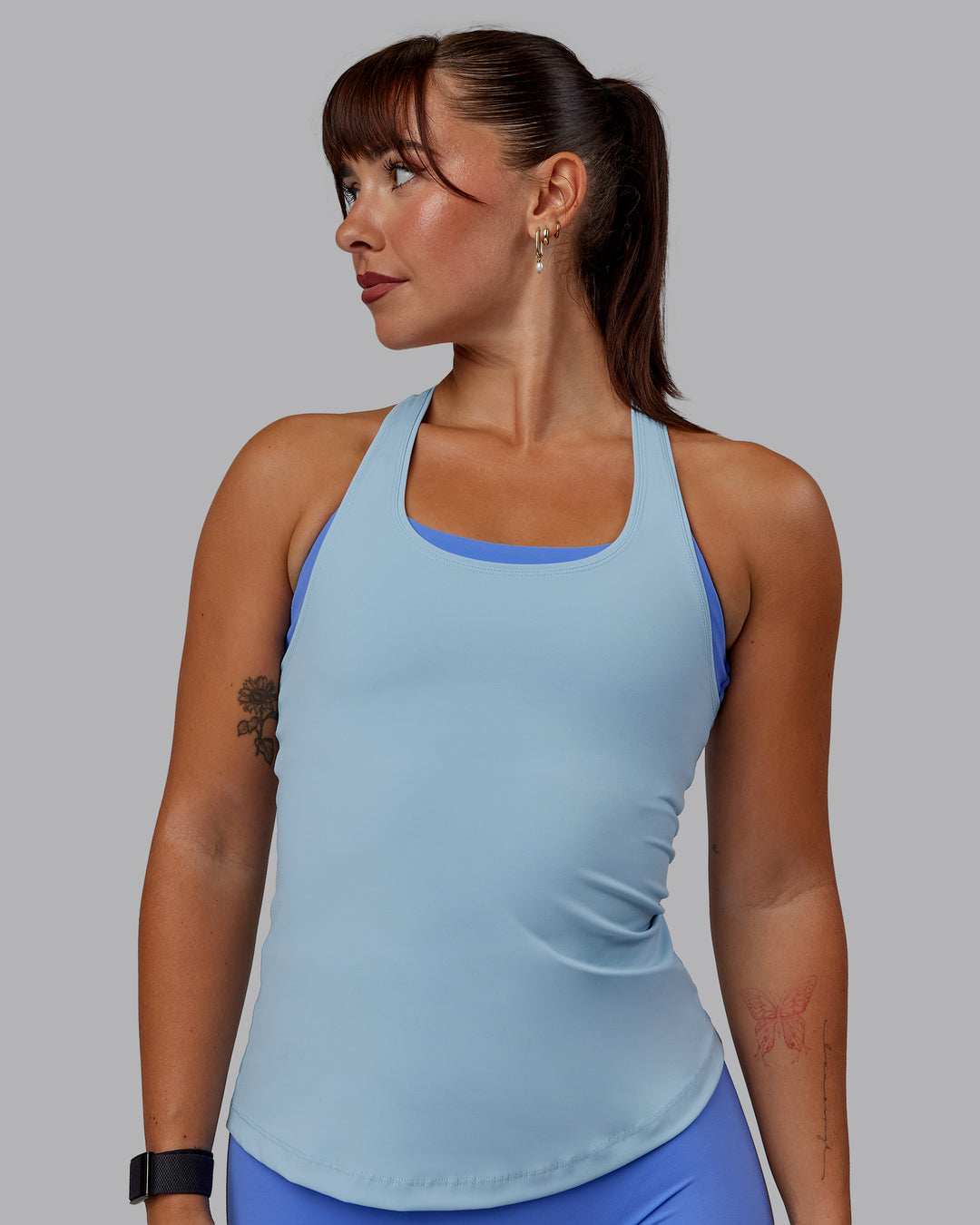 Woman wearing Lift Performance Tank - Glacial Blue - view 1