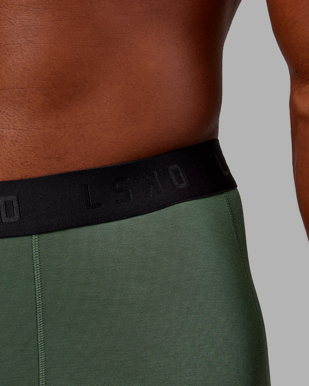 Man wearing MVP Trunks 3 Pack - Black/Cilantro/Midnight Blue - view 10