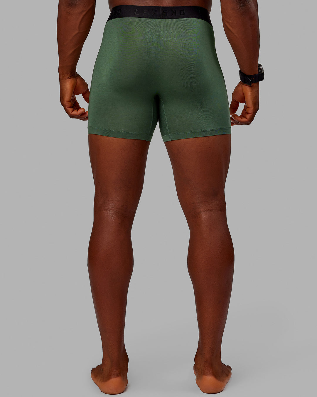 Man wearing MVP Trunks 3 Pack - Black/Cilantro/Midnight Blue - view 9