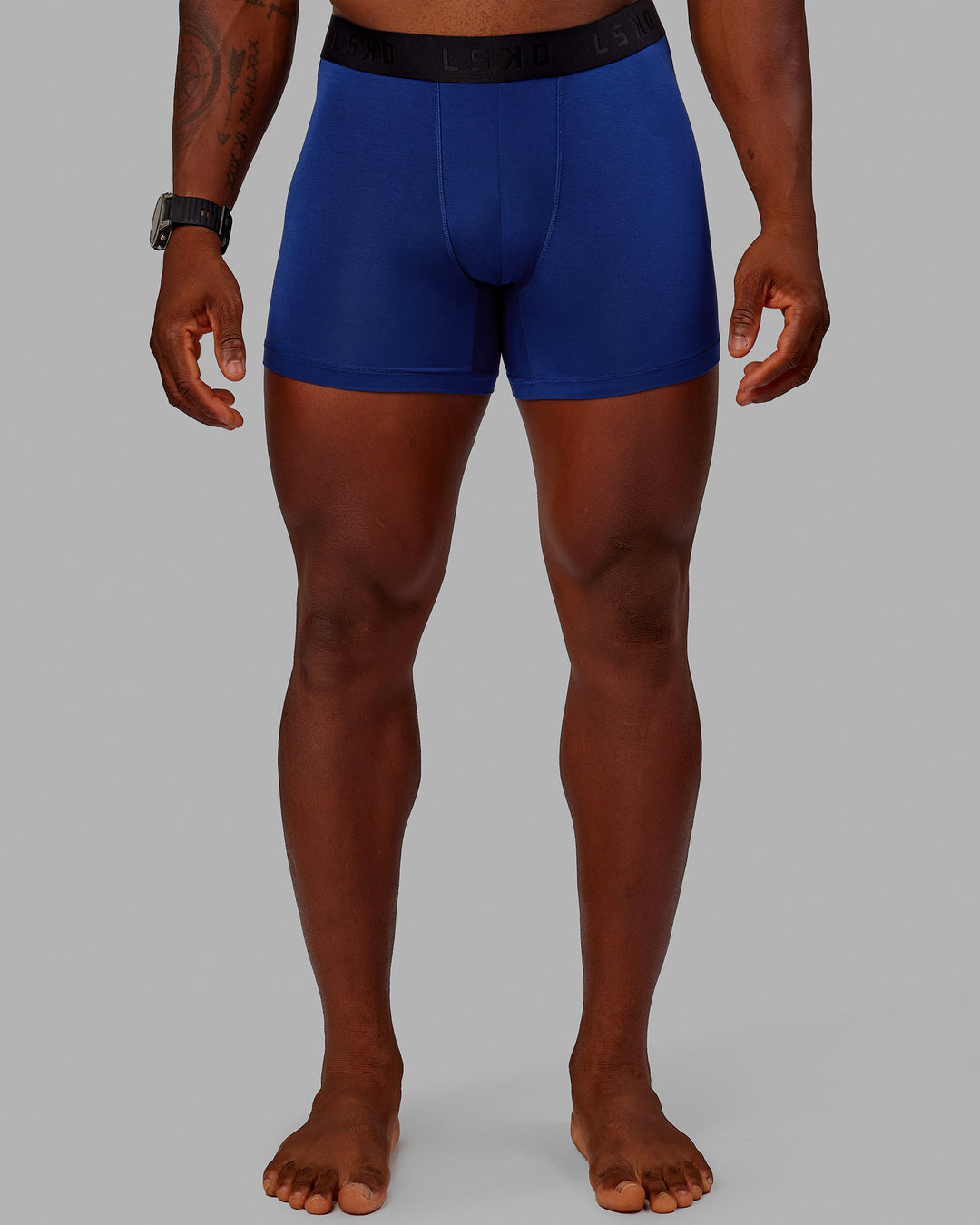 Man wearing MVP Trunks 3 Pack - Black/Cilantro/Midnight Blue - view 2