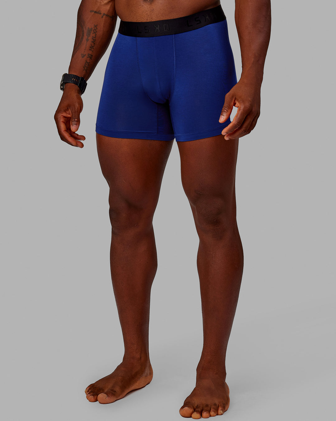 Man wearing MVP Trunks 3 Pack - Black/Cilantro/Midnight Blue - view 7