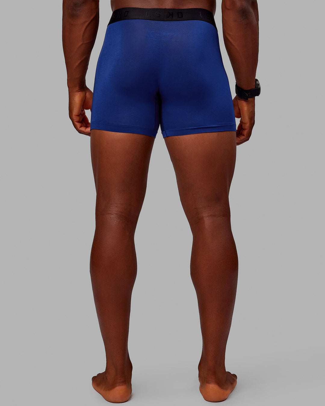 Man wearing MVP Trunks 3 Pack - Black/Cilantro/Midnight Blue - view 5