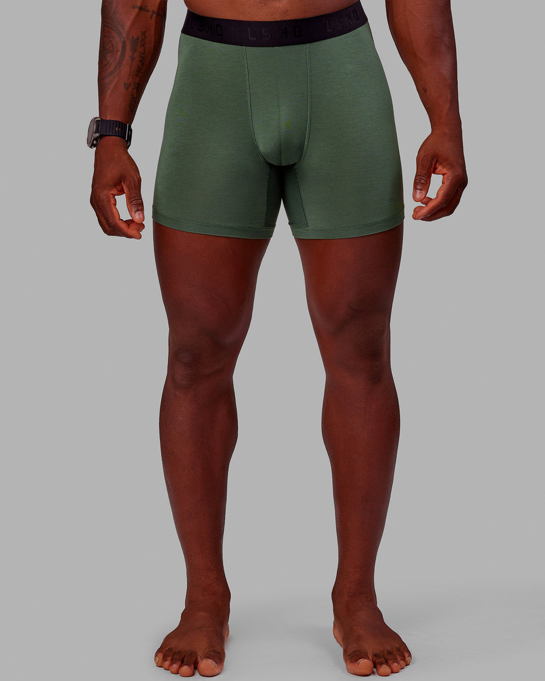 Man wearing MVP Trunks 3 Pack - Black/Cilantro/Midnight Blue - view 3