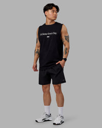 Man wearing 1% Better FLXCotton Training Fit Tank - Black-White | Thumbnail Index: 0