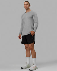 Man wearing AeroFLX+ Seamless Long Sleeve Tee - Light Grey Marl | Thumbnail Index: 6