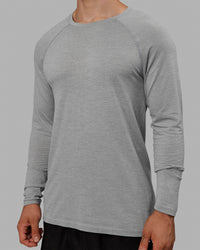 Man wearing AeroFLX+ Seamless Long Sleeve Tee - Light Grey Marl | Thumbnail Index: 7