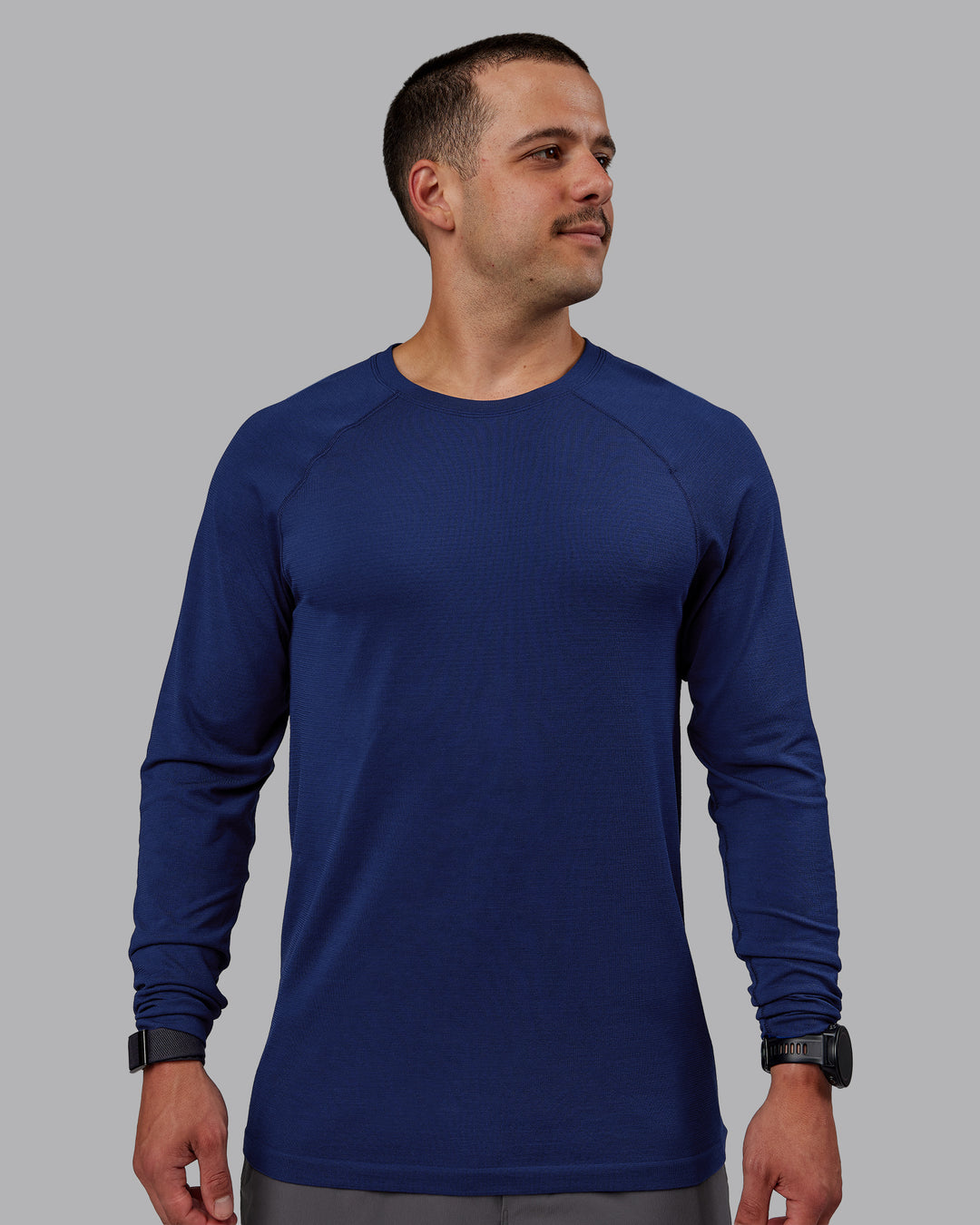 Man wearing AeroFLX+ Seamless Long Sleeve Tee - Midnight Blue/Midnight Blue Marl - view 2