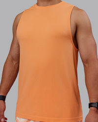 Man wearing AeroFLX+ Seamless Muscle Tank - Cantaloupe/Cantaloupe Marl | Thumbnail Index: 2