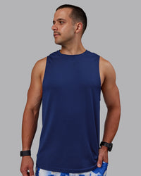 Man wearing AeroFLX+ Seamless Muscle Tank - Midnight Blue/Midnight Blue Marl | Thumbnail Index: 0