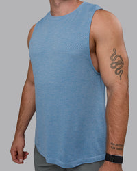 Man wearing AeroFLX+ Seamless Muscle Tank - Elemental Blue/Ice Blue | Thumbnail Index: 2