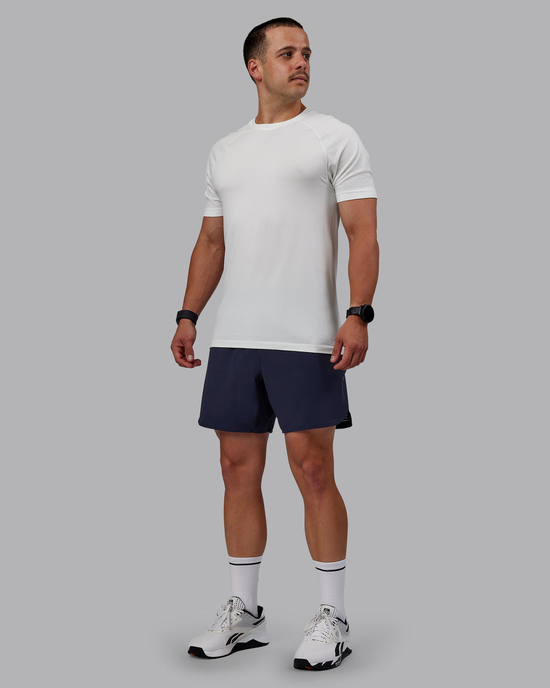 Man wearing AeroFLX+ Seamless Tee - Off White/Off White Marl - view 1