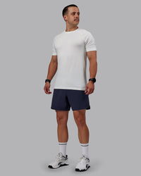 Man wearing AeroFLX+ Seamless Tee - Off White/Off White Marl | Thumbnail Index: 0