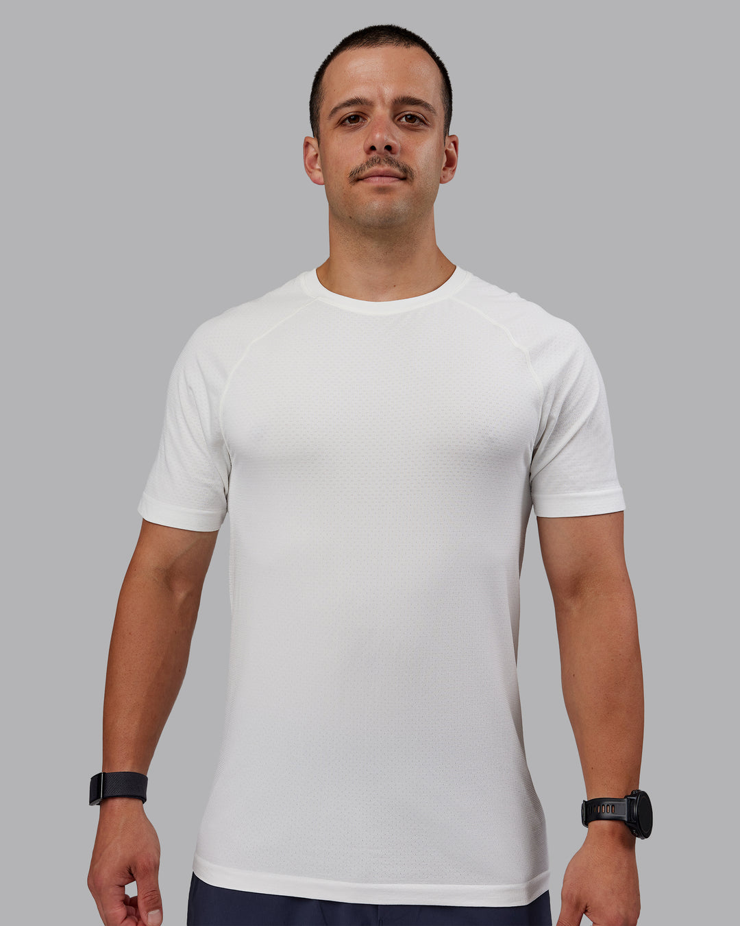 Man wearing AeroFLX+ Seamless Tee - Off White/Off White Marl - view 2