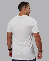Man wearing AeroFLX+ Seamless Tee - Off White/Off White Marl | Thumbnail Index: 3