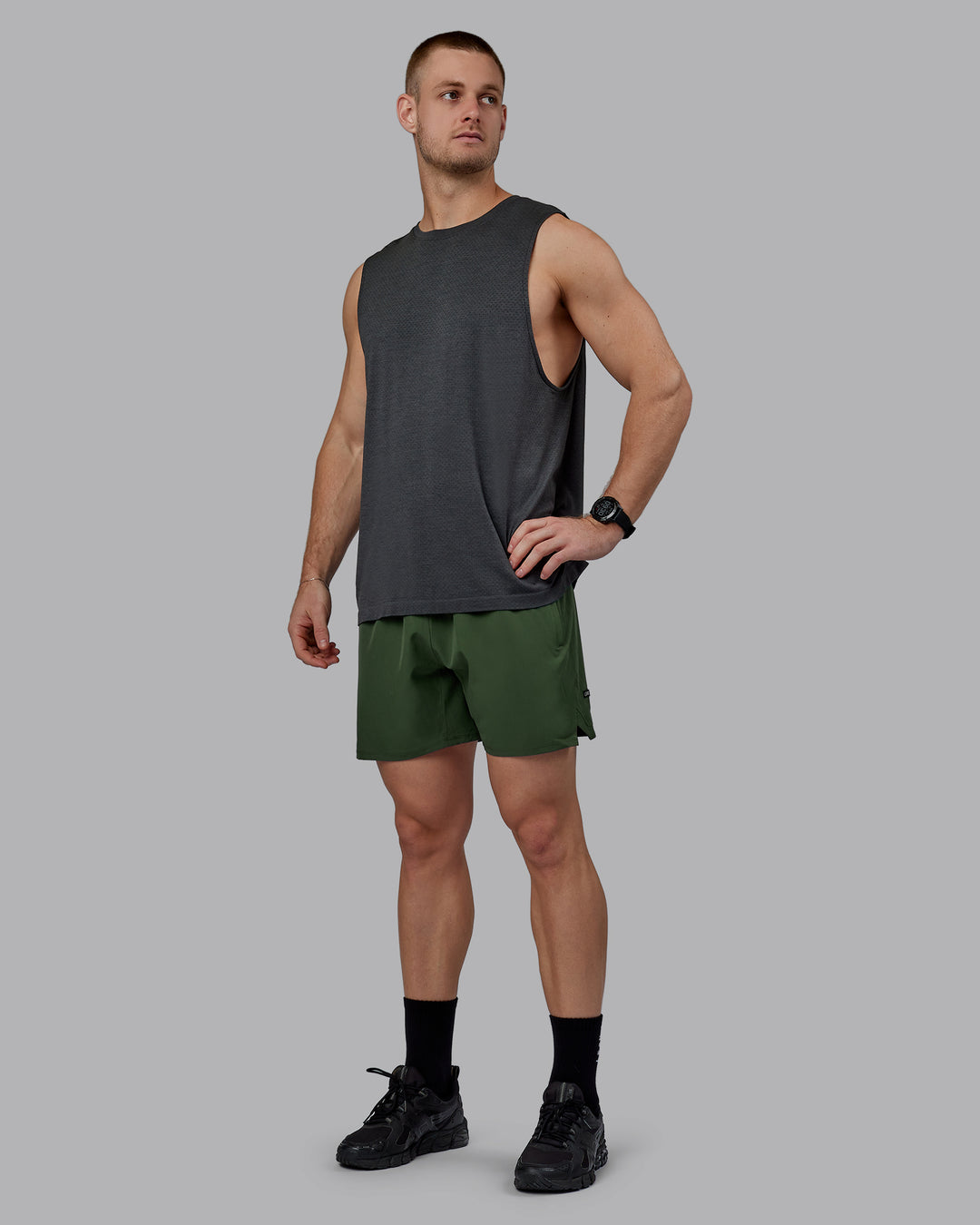 Man wearing AeroFLX+ Seamless Muscle Tank - Pirate Black Marl - view 5