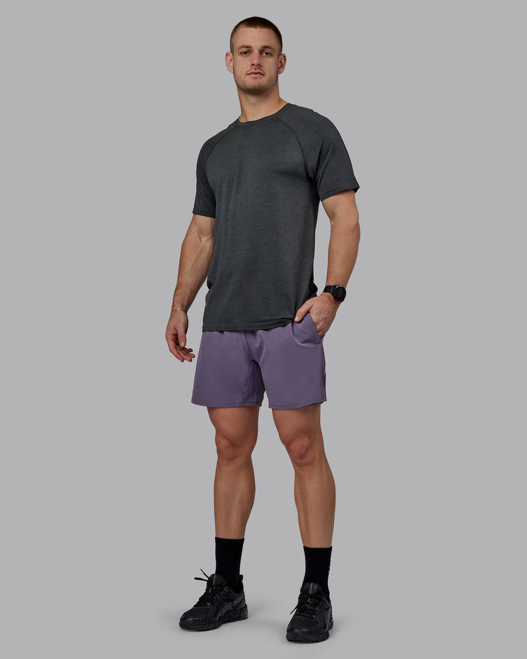 Man wearing AeroFLX+ Seamless Tee - Pirate Black Marl - view 7