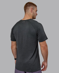 Man wearing AeroFLX+ Seamless Tee - Pirate Black Marl | Thumbnail Index: 2