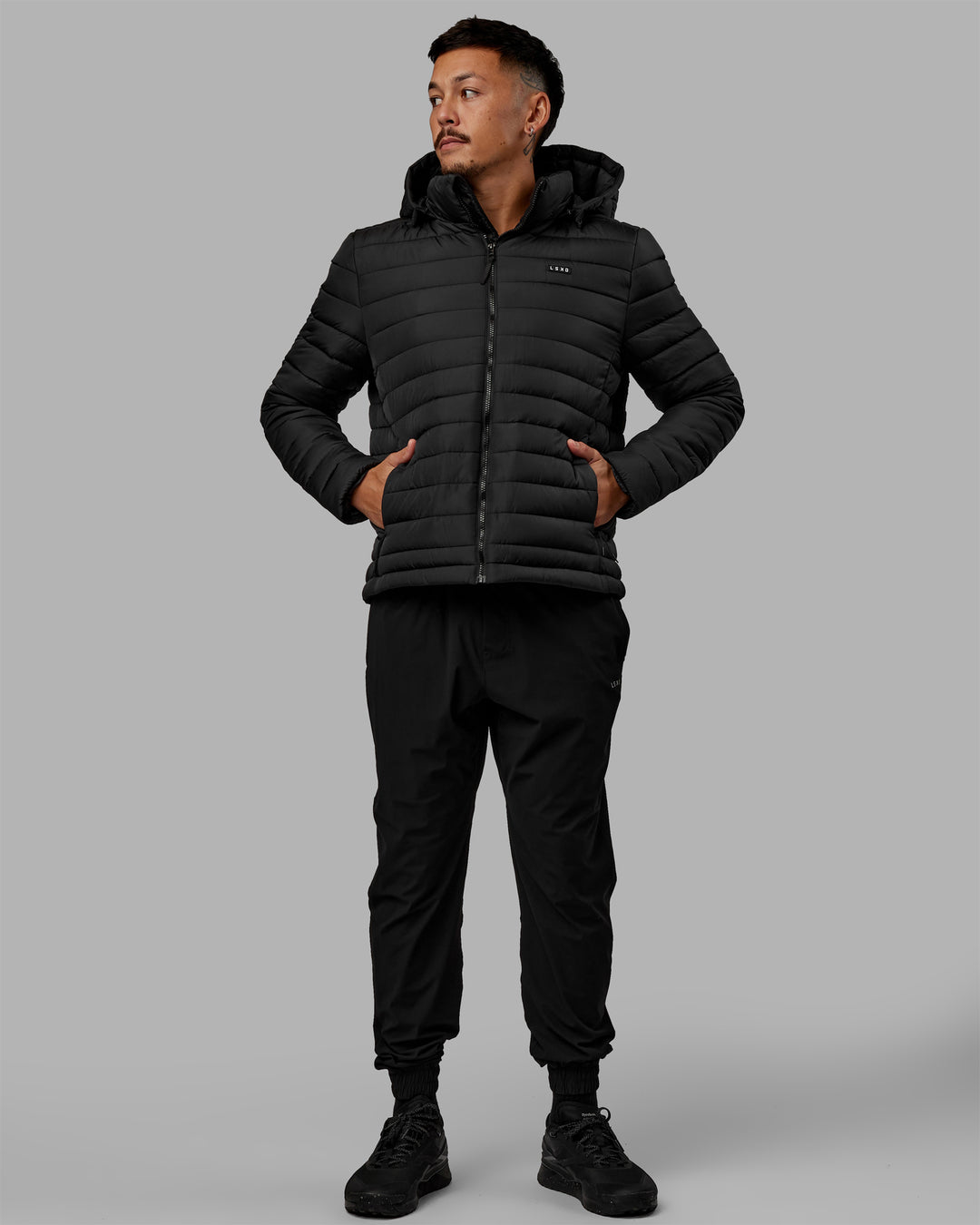 Man wearing All-day Puffer Jacket - Black - view 9