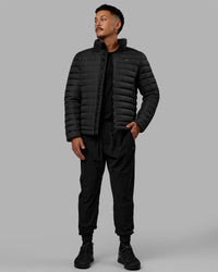 Man wearing All-day Puffer Jacket - Black | Thumbnail Index: 11