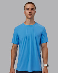 Man wearing Cadence Tee - Azure Blue | Thumbnail Index: 1