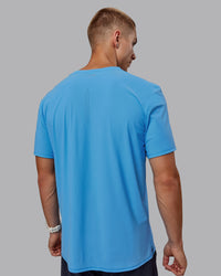 Man wearing Cadence Tee - Azure Blue | Thumbnail Index: 2