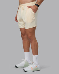 Man wearing Restore 6" CloudFLX Shorts - Ivory | Thumbnail Index: 0