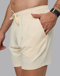 Man wearing Restore 6" CloudFLX Shorts - Ivory | Thumbnail Index: 6