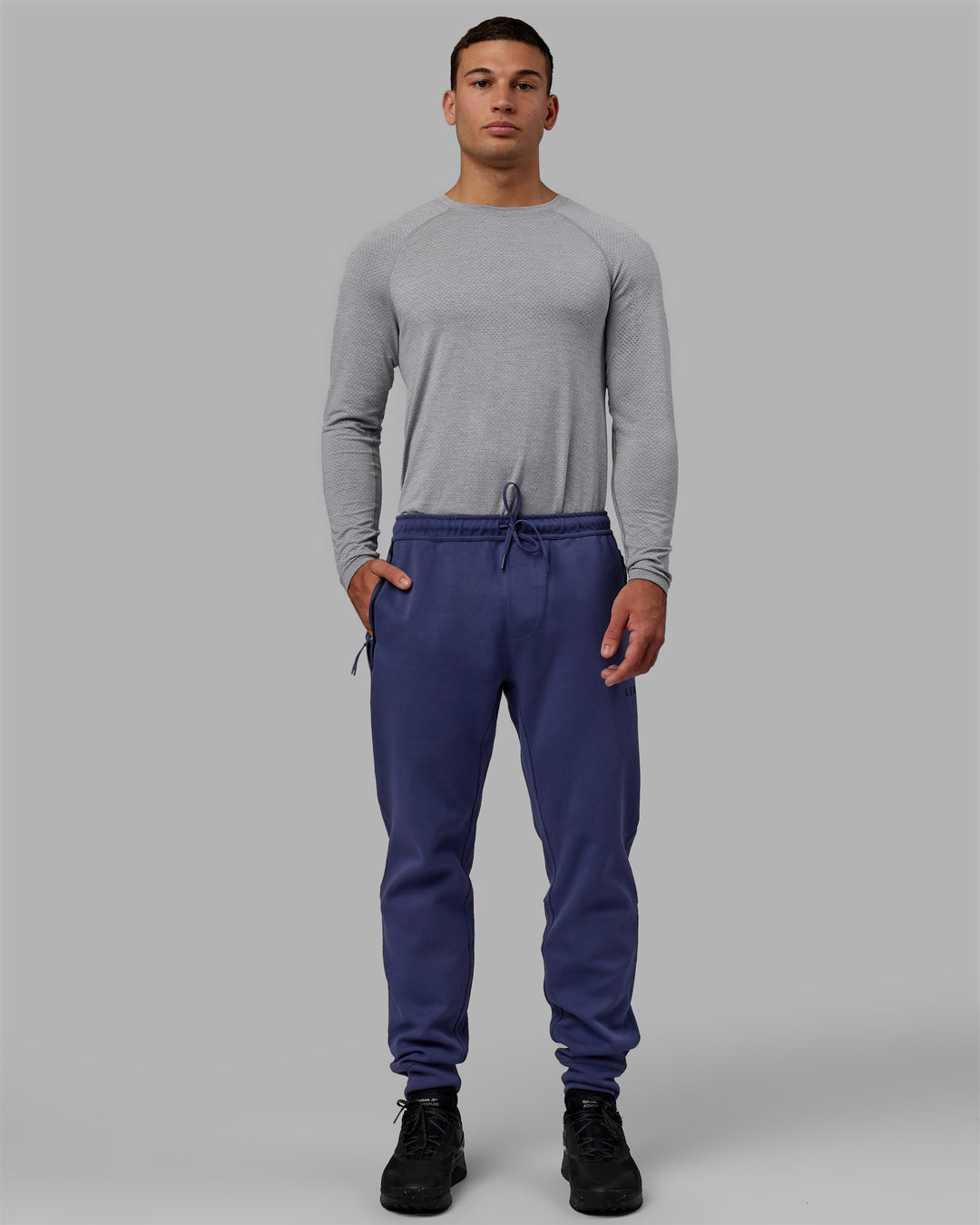 Man wearing Athlete ForgedFleece Zip Track Pants - Future Dusk - view 5