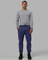 Man wearing Athlete ForgedFleece Zip Track Pants - Future Dusk | Thumbnail Index: 4