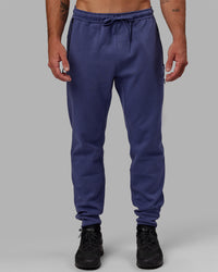 Man wearing Athlete ForgedFleece Zip Track Pants - Future Dusk | Thumbnail Index: 0