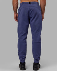 Man wearing Athlete ForgedFleece Zip Track Pants - Future Dusk | Thumbnail Index: 3