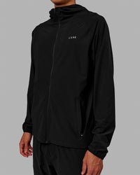 Man wearing Train-Lite FLXMAX Jacket - Black | Thumbnail Index: 5