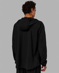 Man wearing Train-Lite FLXMAX Jacket - Black | Thumbnail Index: 2