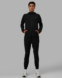Man wearing Train-Lite FLXMAX Pant - Black | Thumbnail Index: 7