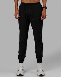 Man wearing Train-Lite FLXMAX Pant - Black | Thumbnail Index: 5