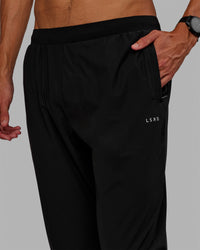 Man wearing Train-Lite FLXMAX Pant - Black | Thumbnail Index: 1
