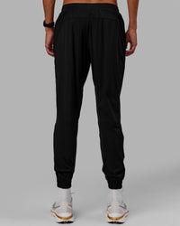 Man wearing Train-Lite FLXMAX Pant - Black | Thumbnail Index: 2