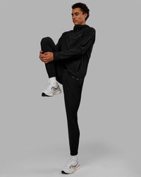 Man wearing Train-Lite FLXMAX Pant - Black | Thumbnail Index: 8