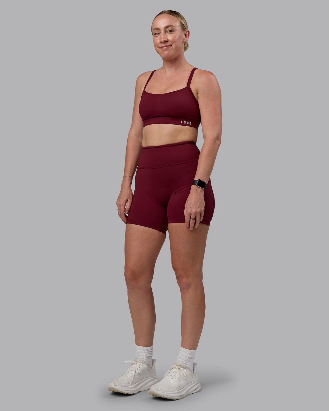 Woman wearing Momentum Sports Bra (D/DD/E) - Cordovan - view 3