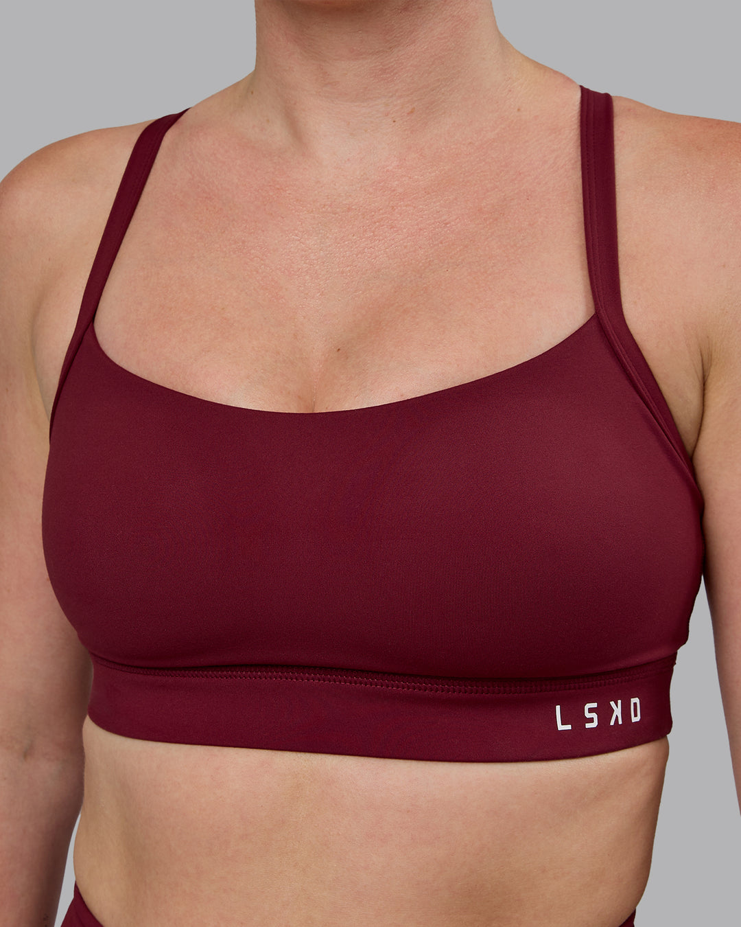 Woman wearing Momentum Sports Bra (D/DD/E) - Cordovan - view 4